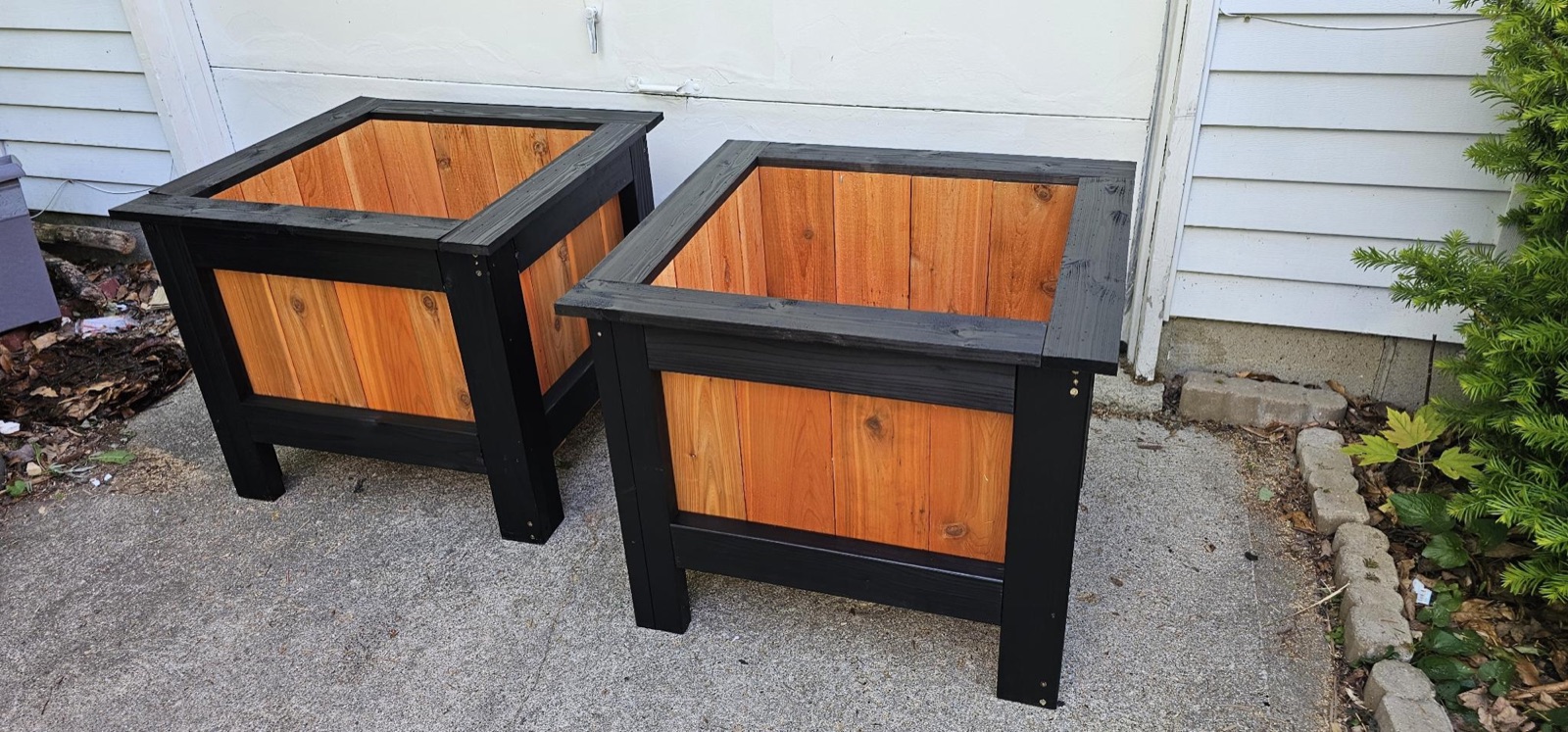 Cedar-paneled outdoor planters, black-painted frames (pair)